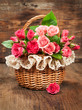 pink roses in a vintage basket