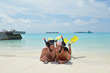 happy young couple have fun on beach