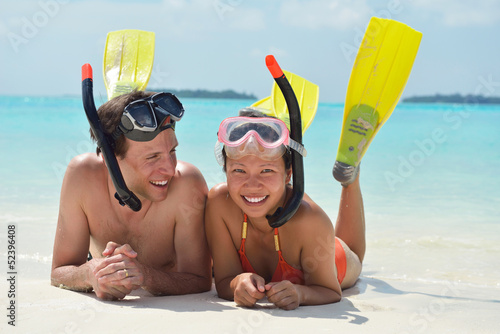Photo: happy young couple have fun on beach happy young couple have fun on beach