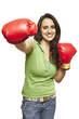 Young woman wearing boxing gloves smiling