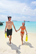 happy young couple have fun on beach