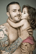 Foto: Father and daughter, man with tattoo Father and daughter, man with tattoo