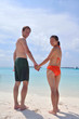 happy young couple have fun on beach