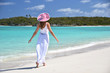 Girl on the desrt beach. Exuma, Bahamas