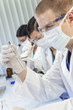 Photo: Male Scientist or Doctor With Test Tube In Laboratory Male Scientist or Doctor With Test Tube In Laboratory