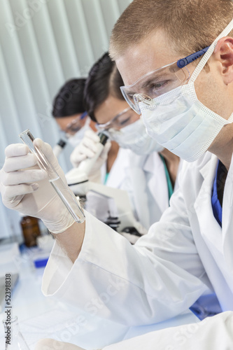 Photo: Male Scientist or Doctor With Test Tube In Laboratory Male Scientist or Doctor With Test Tube In Laboratory