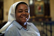 Woman and spirituality, portrait of catholic nun praying in chur