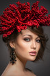 Spring beauty portrait of handsome girl with rowanberry on head