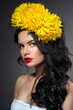 Beauty portrait of handsome girl with yellow flowers on head