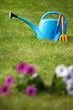 Gardening tools on a freshly cut well groomed grass