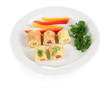 Foto: Egg rolls with cheese cream and paprika,on plate, isolated Egg rolls with cheese cream and paprika,on plate, isolated