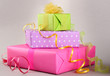 Bright gifts with bows on grey background