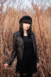 Beautiful female in black dress and hat