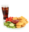 Fried chicken nuggets with vegetables,cola and sauce isolated