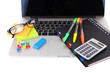 Laptop with stationery isolated on white