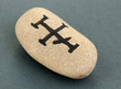 Fortune telling  with symbols on stone on grey background