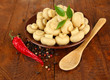 Mushrooms on plate, on wooden background