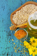 Fragrant honey spa with oils and honey on wooden table close-up