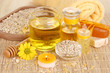 Fragrant honey spa with oils and honey on wooden table close-up