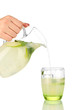 Lemonade in pitcher and glass isolated on white