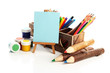 Photo: Different pencils in wooden crate, paints and easel, isolated Different pencils in wooden crate, paints and easel, isolated