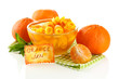 Orange jam with zest and tangerines, isolated on white
