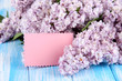 Beautiful lilac flowers on table close-up