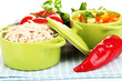 Shredded boiled chicken in green pan close up
