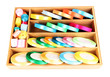 Bright silk ribbons in wooden box, isolated on white