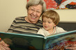 Grandma Reads Book With Child 2