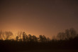Eery nighttime landscape in countryside