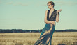 fashion model posing outdoor in a rural setting