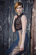 fashion model posing outdoor in a rural setting