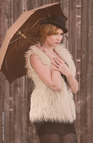 Photo: fashion model posing outdoor in a rural setting fashion model posing outdoor in a rural setting