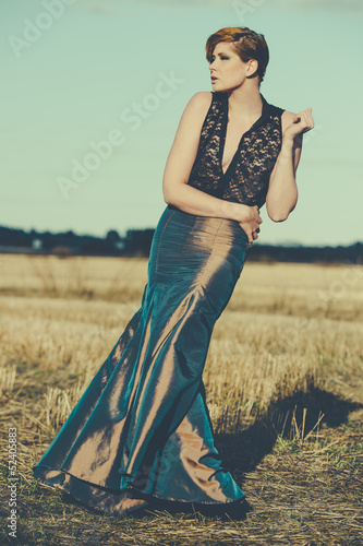 Photo: fashion model posing outdoor in a rural setting fashion model posing outdoor in a rural setting