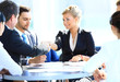 Happy business man and woman shaking hands