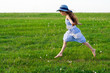 Photo: Girl runs on meadow with dandelions Girl runs on meadow with dandelions