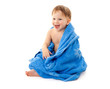 Smiling little boy in towel