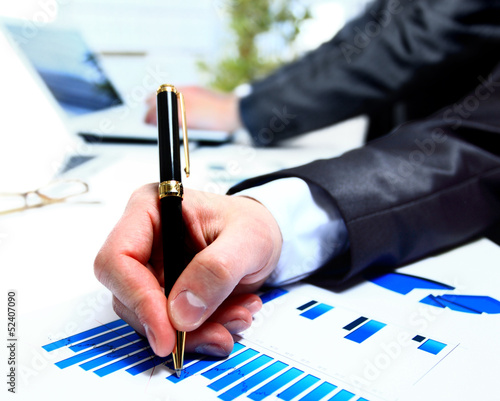Photo: Two business people discuss financial issues Two business people discuss financial issues