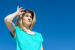 Woman raising sunglasses