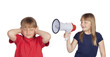 Photo: Little girl with megaphone shouting to her twin sister Little girl with megaphone shouting to her twin sister
