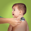 Photo: Adorable baby at the doctor's office for a pediatric examination Adorable baby at the doctor's office for a pediatric examination