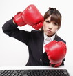 Office lady is tired of working and plays boxing for fun.