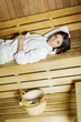 Young woman in the sauna