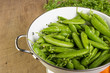 Fresh green peas in bowl