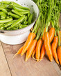 Fresh green peas and carrots