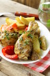 baked chicken legs with vegetables for garnish
