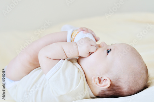 Photo: baby playing with legs baby playing with legs