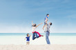 Asian family enjoy time at beach