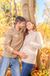 pregnant couple woods
